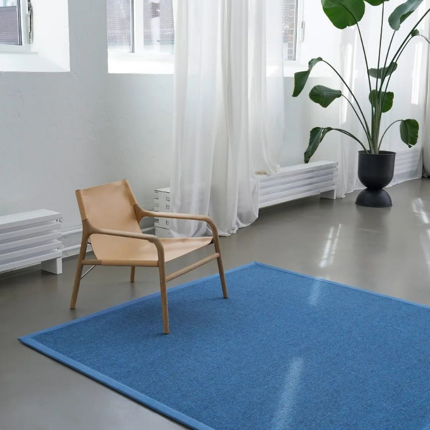 tretford wollen vloerkleed blauw interieurfoto